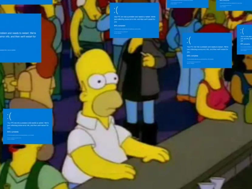 Meme de Homero en la taberna con todos a su alrededor quejándose por el fallo de Windows y él sin problemas